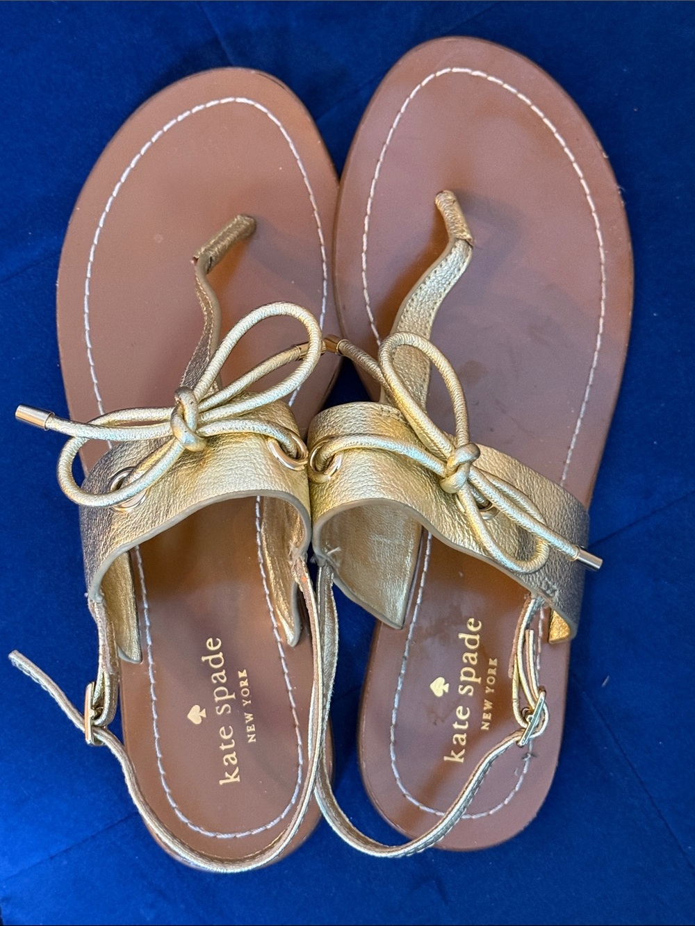 kate spade Gold Leather Bow Toe Ring Sandals
